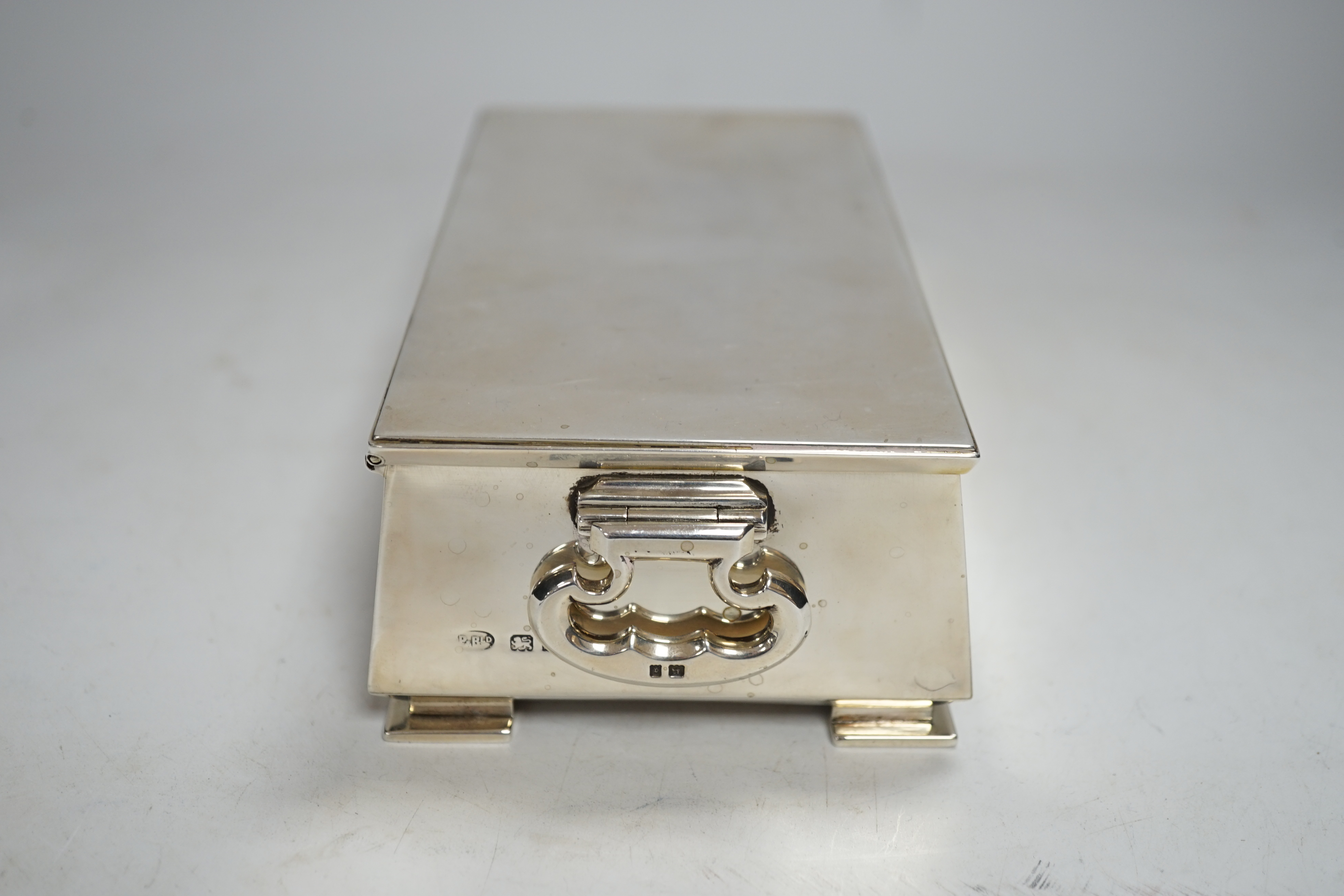 A George V Art Deco silver mounted two handled cigarette box, Padgett & Braham Ltd, London, 1935, 18.5cm.